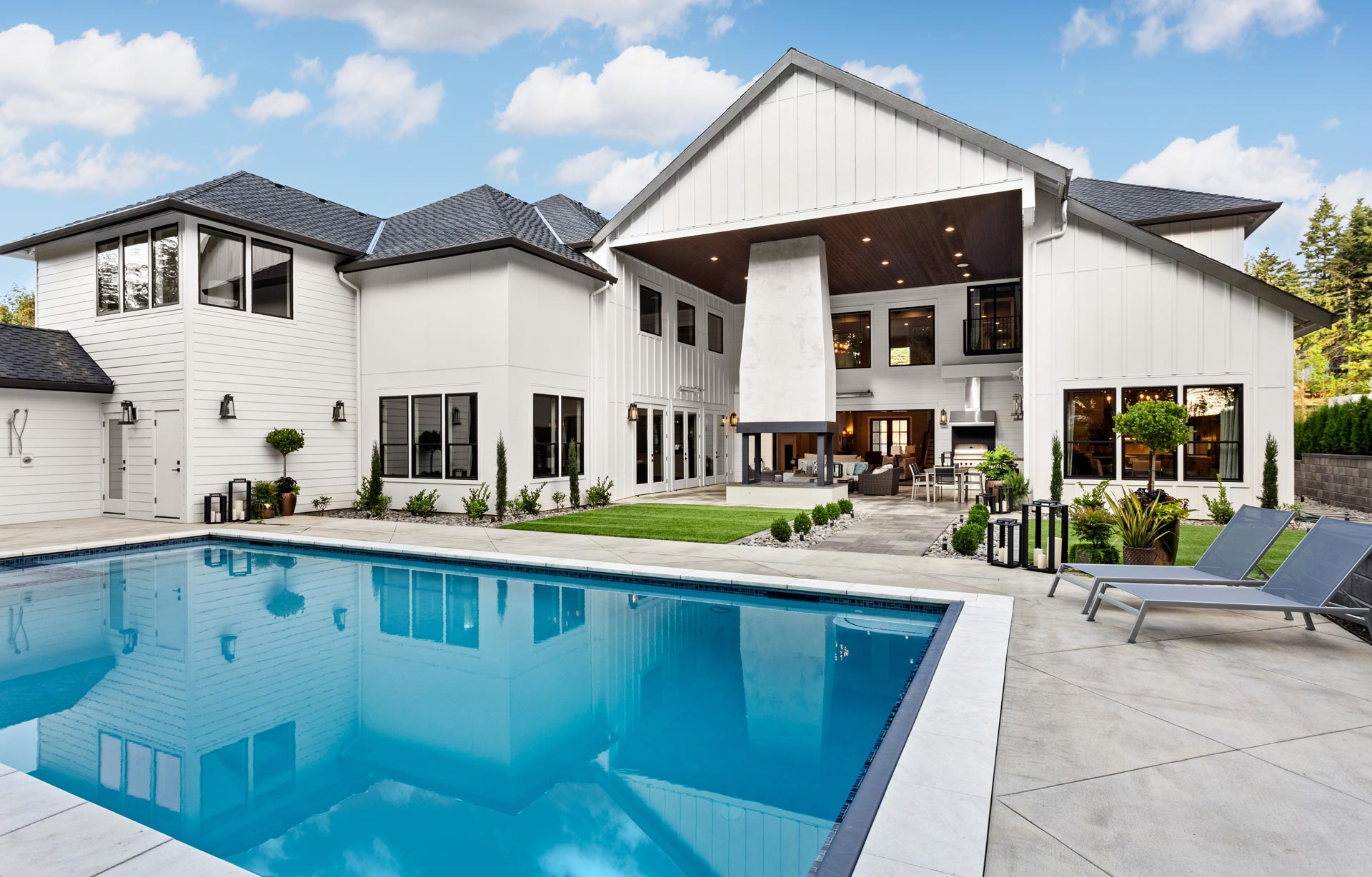 Custom vinyl swimming pool with fireside patio built by Barr Pools in Davis County, Utah