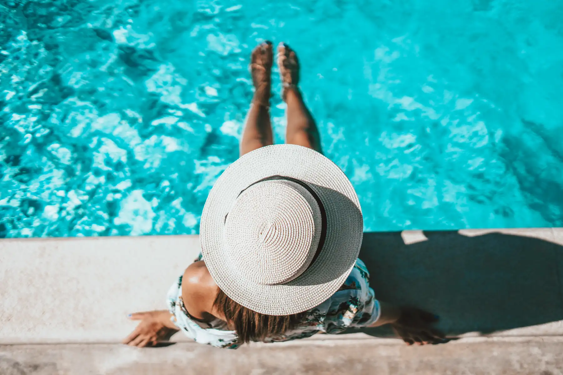 Logan Poolside Tanning Ledge — Barr Pool Builders Sun-drenched poolside tanning ledge on a custom vinyl swimming pool built by Barr Pool Builders in Logan, Utah